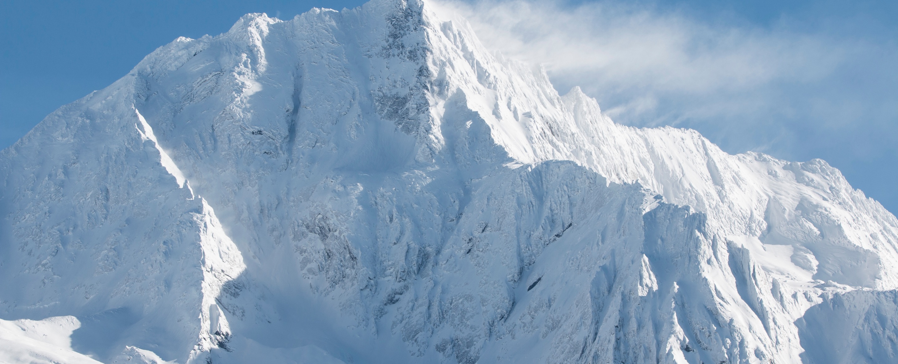 A snowbound Karakoram peak against a clear sky